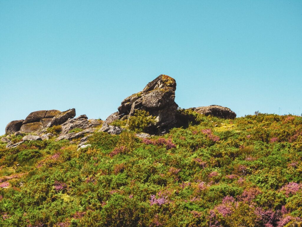 hills greens big rocks cloudy sky
