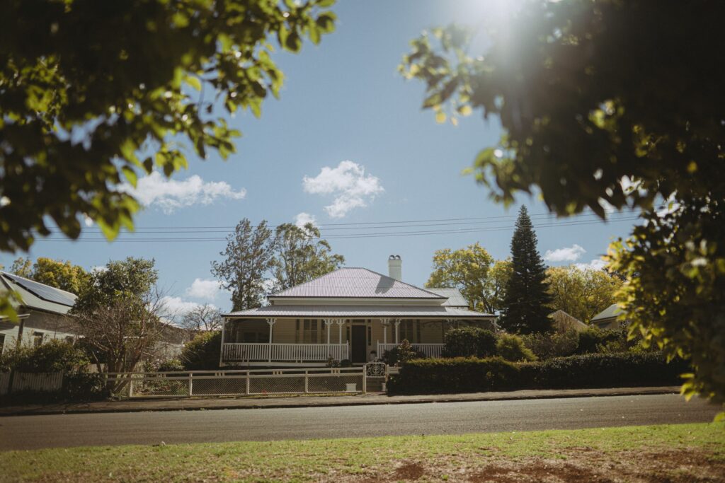 Front of a well-maintained Australian Victorian-style home with strong curb appeal, featuring tidy landscaping and classic architectural details.