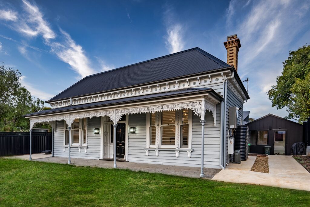 Classic heritage-style investment property with timber cladding and decorative verandah, popular among home buyers in Australia