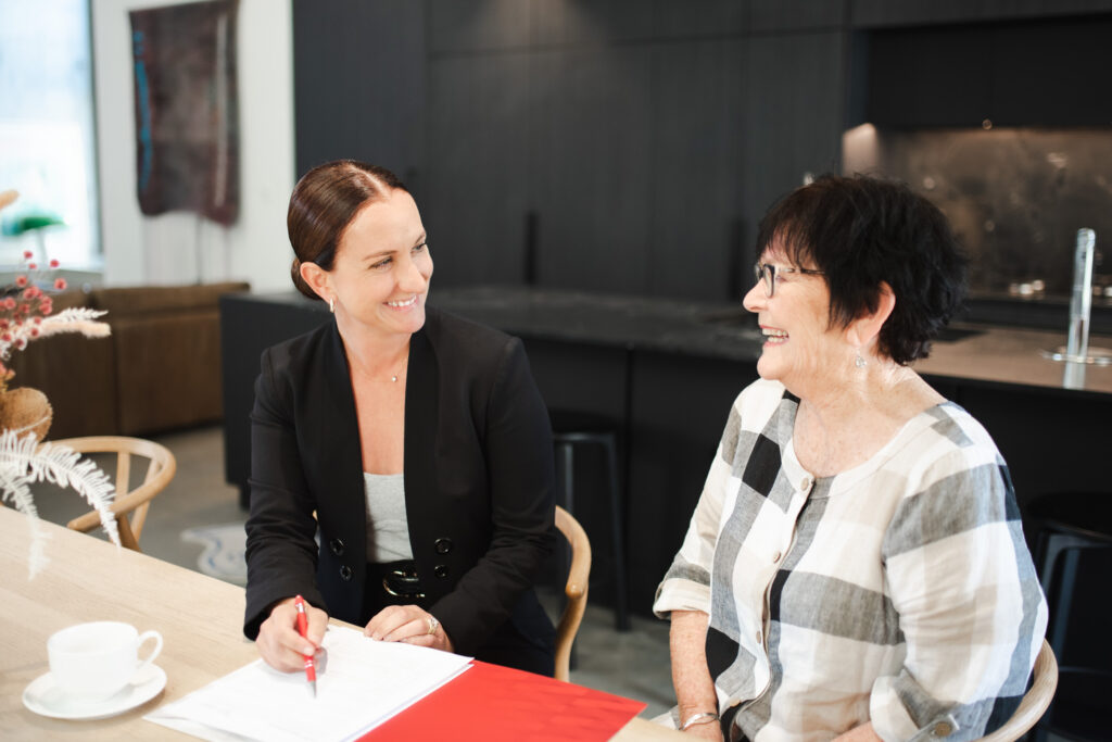 Semple Property Group team member meeting with client to discuss property needs in Perth.