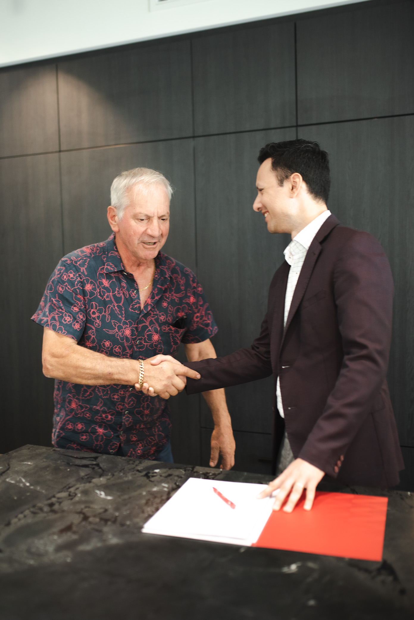 Semple Property Group property manager shaking hands with a Perth rental property owner during a client meeting