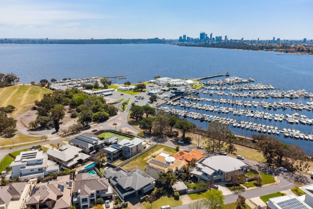 Aerial view of Applecross, Perth WA, showcasing Swan River waterfront living, luxury homes, marinas and the Perth city skyline
